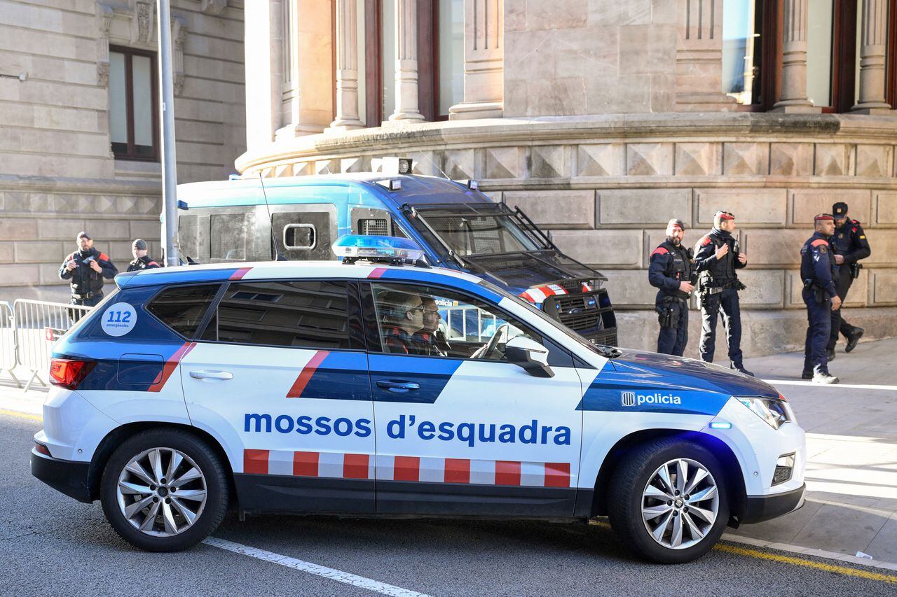 A car of the Catalan regional police forces Mossos d'Esquadra arrives at the High Court of Justice of Catalonia, ahead of the start of Brazilian footballer Dani Alves' trial in Barcelona, on February 5, 2024. Brazilian footballer Dani Alves, a former star at Barca and PSG, goes on trial in Barcelona accused of raping a woman in a local nightclub. Prosecutors are asking for a nine-year prison sentence, followed by 10 years of conditional liberty. They are also asking he pay 150,000 euros ($162,000) in compensation to the woman. (Photo by Josep LAGO / AFP)
