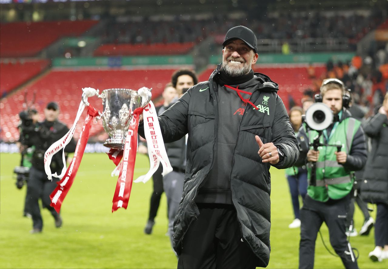 LONDON, ENGLAND - FEBRUARY 25: Jurgen Klopp, Manager of Liverpool celebrates with trophy after winning the Carabao Cup Final match between Chelsea and Liverpool at Wembley Stadium on February 25, 2024 in London, England. (Photo by Nigel French/Sportsphoto/Allstar via Getty Images)