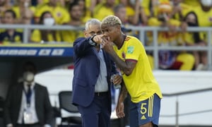 Colombia's coach Reinaldo Rueda gives direction to his player Colombia's Wilmar Barrios during a qualifying soccer match against Peru for the FIFA World Cup Qatar 2022 at Roberto Melendez stadium in Barranquilla, Colombia, Friday, Jan. 28, 2022. (AP Photo/Fernando Vergara)
