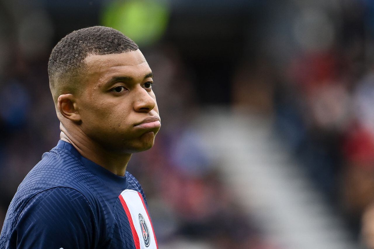 (FILES) Paris Saint-Germain's French forward Kylian Mbappe reacts during the French L1 football match between Paris Saint-Germain (PSG) and FC Lorient at The Parc des Princes Stadium in Paris on April 30, 2023. Paris Saint-Germain president Nasser al-Khelaifi on July 5, 2023 insisted superstar forward Kylian Mbappe "must sign a new contract" if he wants to remain at the club next season. (Photo by FRANCK FIFE / AFP)