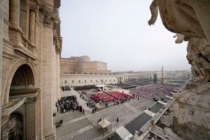 Faithful attend the funeral mass for late Pope Emeritus Benedict XVI in St. Peter's Square at the Vatican, Thursday, Jan. 5, 2023. Benedict died at 95 on Dec. 31 in the monastery on the Vatican grounds where he had spent nearly all of his decade in retirement. (AP Photo/Andrew Medichini)