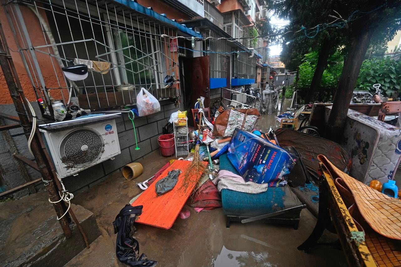 This picture shows a view of the wreckage caused due to heavy rains in Mentougou district in Beijing on July 31, 2023. Heavy rains battered northern China on July 31, killing at least two people in Beijing while washing away cars and inundating subway stations, with the capital issuing its highest alerts for flooding and landslides. (Photo by Pedro PARDO / AFP)