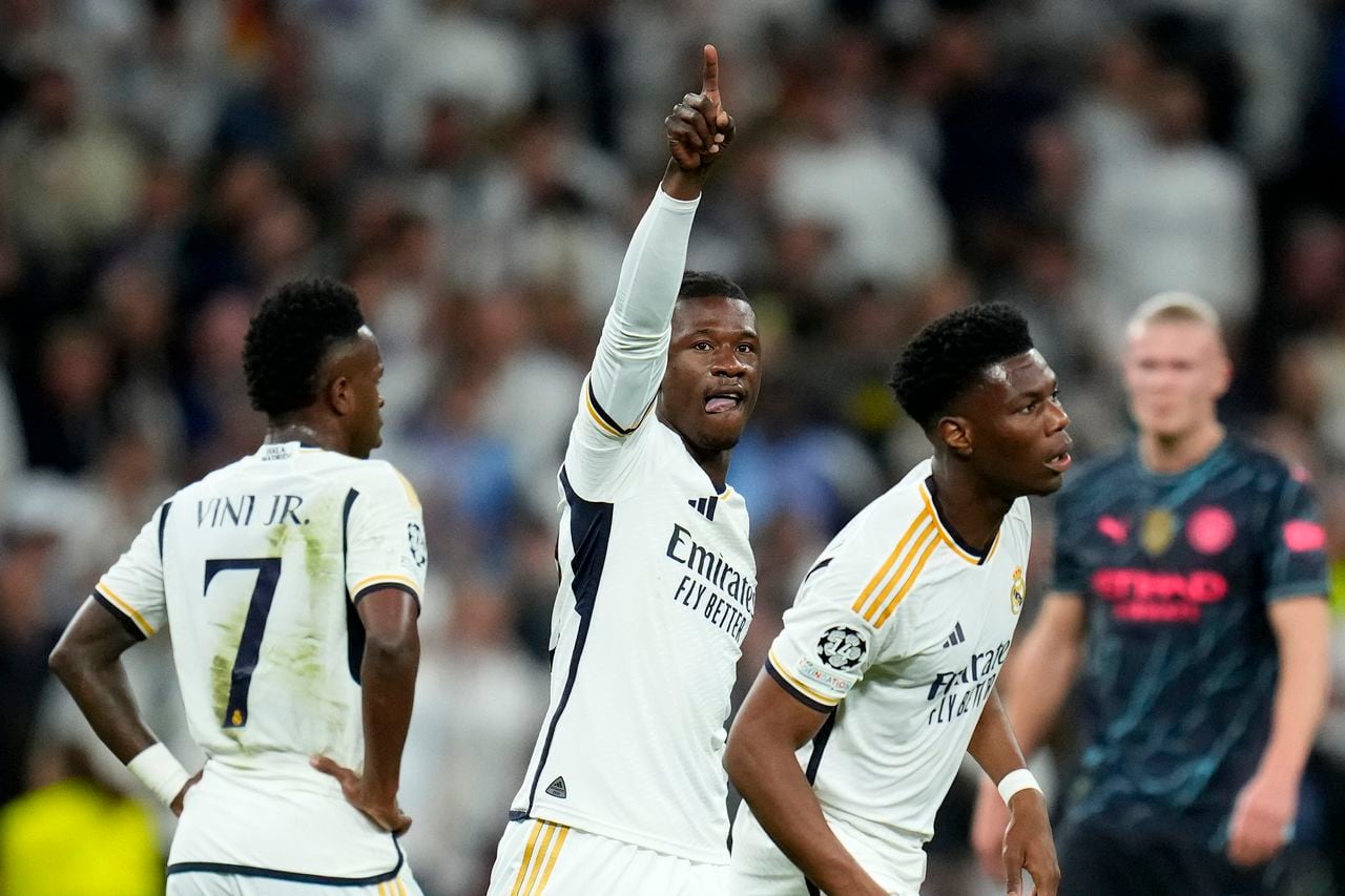 Real Madrid's Eduardo Camavinga celebrates scoring his side's first goal during the Champions League quarterfinal first leg soccer match between Real Madrid and Manchester City at the Santiago Bernabeu stadium in Madrid, Spain, Tuesday, April 9, 2024. (AP Photo/Manu Fernandez)