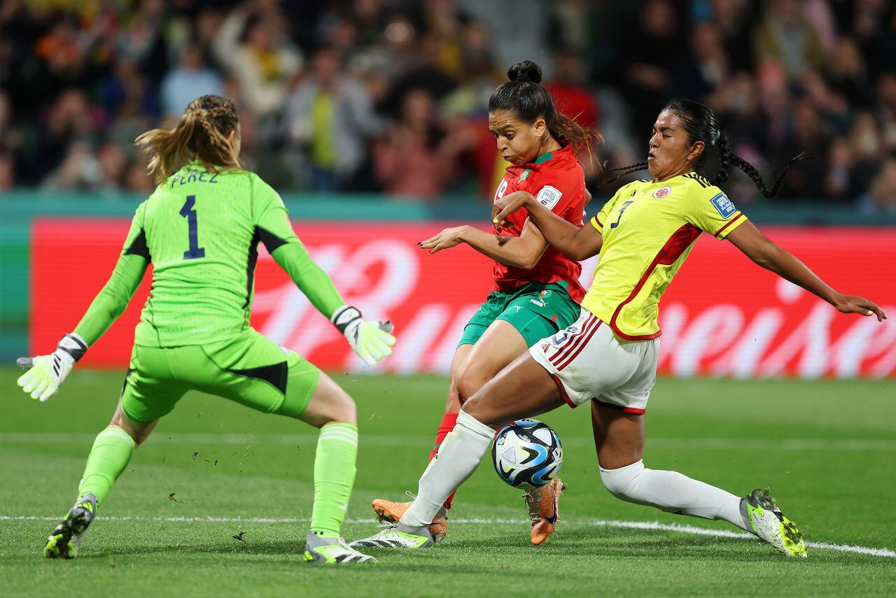 PERTH, AUSTRALIA - AUGUST 03: Sakina Ouzraoui of Morocco takes a shot while Catalina Perez and Daniela Arias of Colombia attempt to block during the FIFA Women's World Cup Australia & New Zealand 2023 Group H match between Morocco and Colombia at Perth Rectangular Stadium on August 03, 2023 in Perth, Australia. (Photo by Paul Kane/Getty Images)