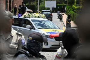 A hearse is seen during the funeral of slain Ecuadorean presidential candidate Fernando Villavicencio at the Vertical Cemetery in Quito on August 11, 2023. Ecuador declared a state of emergency Thursday and asked the FBI to help probe the assassination of a popular presidential candidate, whose death has highlighted the once-peaceful nation's decline into a violent hotbed of drug trafficking and organized crime. (Photo by Rodrigo BUENDIA / AFP)