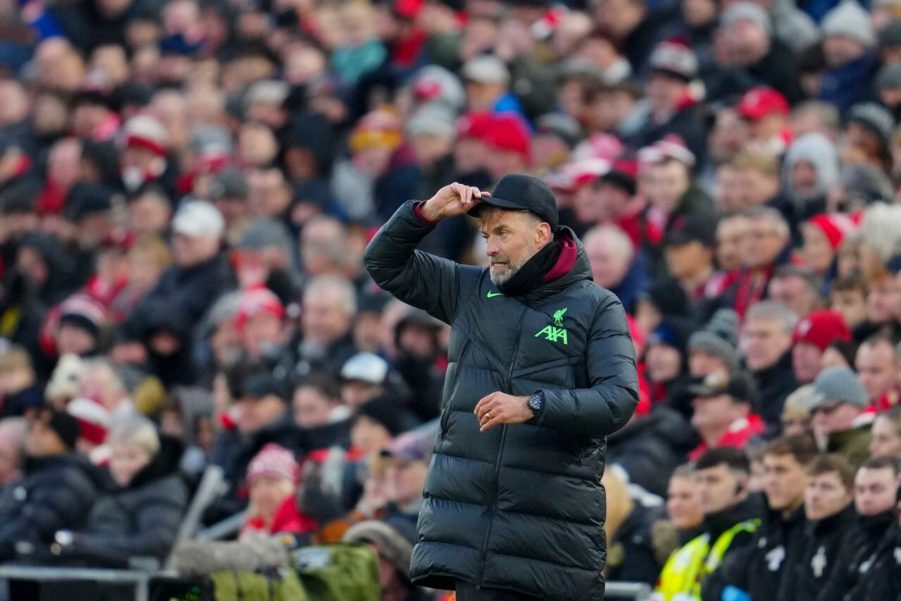 Liverpool's manager Jurgen Klopp adjust his cap during the English Premier League soccer match between Liverpool and Brentford at Anfield stadium in Liverpool, England, Sunday, Nov. 12, 2023. (AP Photo/Jon Super)