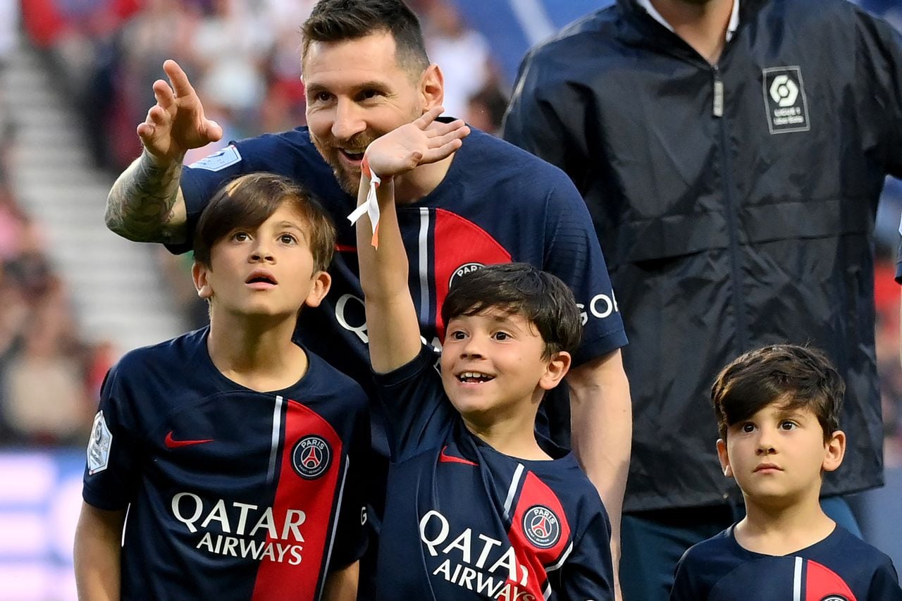 Paris Saint-Germain's Argentine forward Lionel Messi attends with his children prior to the French L1 football match between Paris Saint-Germain (PSG) and Clermont Foot 63 at the Parc des Princes Stadium in Paris on June 3, 2023. (Photo by FRANCK FIFE / AFP)