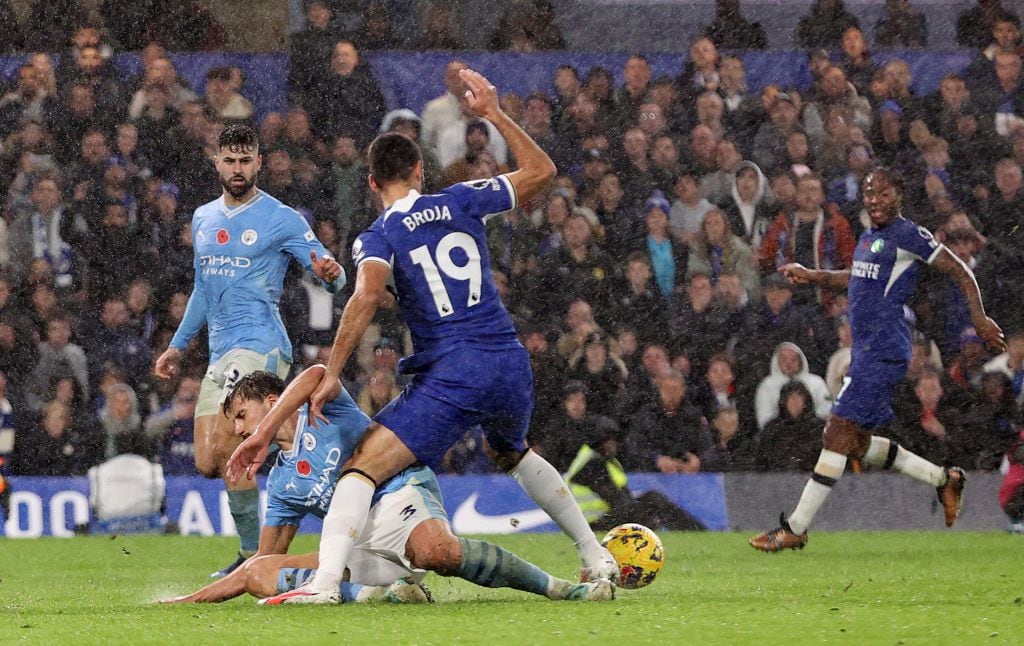 LONDON, ENGLAND - NOVEMBER 12: Rodri of Manchester City is fouled by Armando Broja of Chelsea leading to a penalty being awarded during the Premier League match between Chelsea FC and Manchester City at Stamford Bridge on November 12, 2023 in London, England. (Photo by Ryan Pierse/Getty Images)
