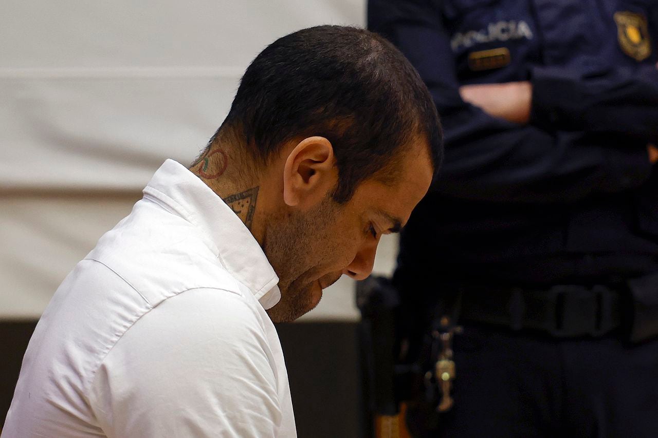 Brazilian footballer Dani Alves looks down during his trial at the High Court of Justice of Catalonia in Barcelona, on February 5, 2024. Brazilian footballer Dani Alves, a former star at Barca and PSG, goes on trial in Barcelona accused of raping a woman in a local nightclub. Prosecutors are asking for a nine-year prison sentence, followed by 10 years of conditional liberty. They are also asking he pay 150,000 euros ($162,000) in compensation to the woman. (Photo by ALBERTO EST�VEZ / POOL / AFP)