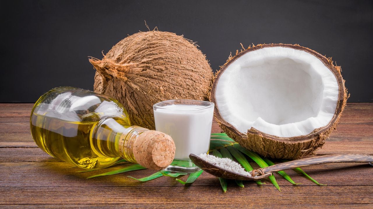 Coconut milk and coconut oil on wooden table