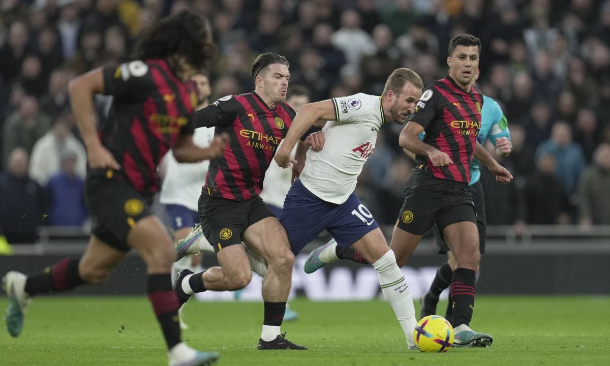 Tottenham's Harry Kane, 3rd left, is challenged by Manchester City's Jack Grealish, 2nd left, during an English Premier League soccer match between Tottenham Hotspur v Manchester City at the Tottenham Hotspur Stadium in London, Sunday, Feb. 5, 2023. (AP/Kin Cheung)