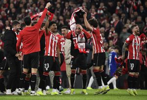 Athletic Bilbao players celebrate their victory at the end of the Spanish Copa del Rey (King's Cup) semi final second leg football match between Athletic Club Bilbao and Club Atletico de Madrid at the San Mames stadium in Bilbao on February 29, 2024. (Photo by ANDER GILLENEA / AFP)