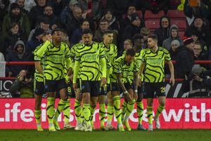 Arsenal's Martin Odegaard celebrates with teammates after scoring his side's opening goal during the English Premier League soccer match between Sheffield United and Arsenal at the Bramall Lane stadium in Sheffield, England, Monday, March 4, 2024. (AP Photo/Rui Vieira)