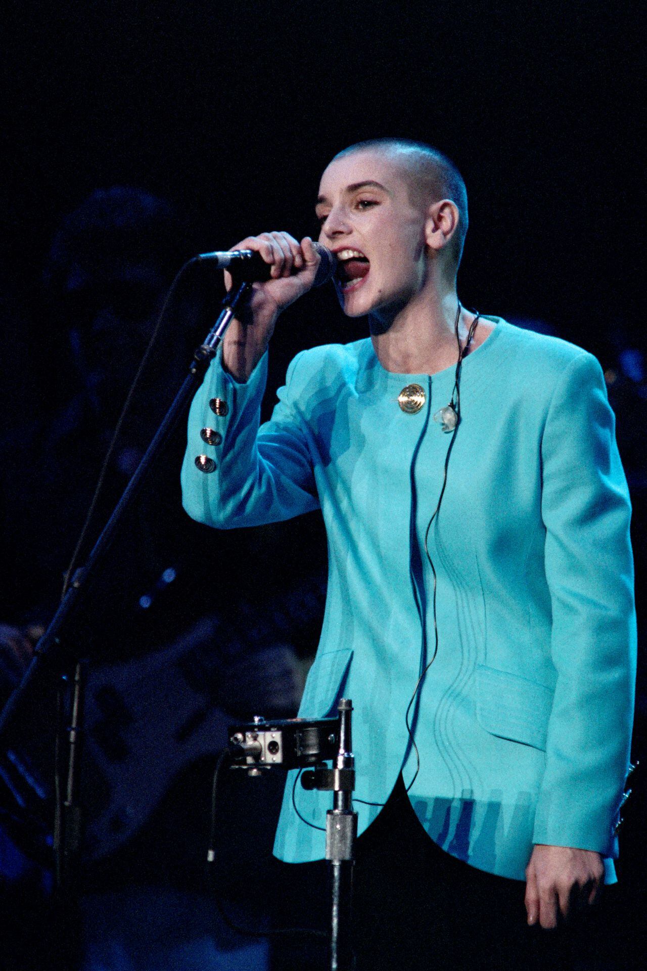 (FILES) Irish singer Sinead O'Connor performs at the Highline Ballroom in New York City on February 23, 2012. Irish pop singer Sinead O'Connor, who shot to fame in the 1990s, has died at the age of 56, Irish media reported on July 26, 2023. In a statement her family said it was with "great sadness that we announce the passing of our beloved Sinead. Her family and friends are devastated and have requested privacy at this very difficult time," Irish national broadcaster RTE reported. (Photo by Jason Kempin / GETTY IMAGES NORTH AMERICA / AFP)