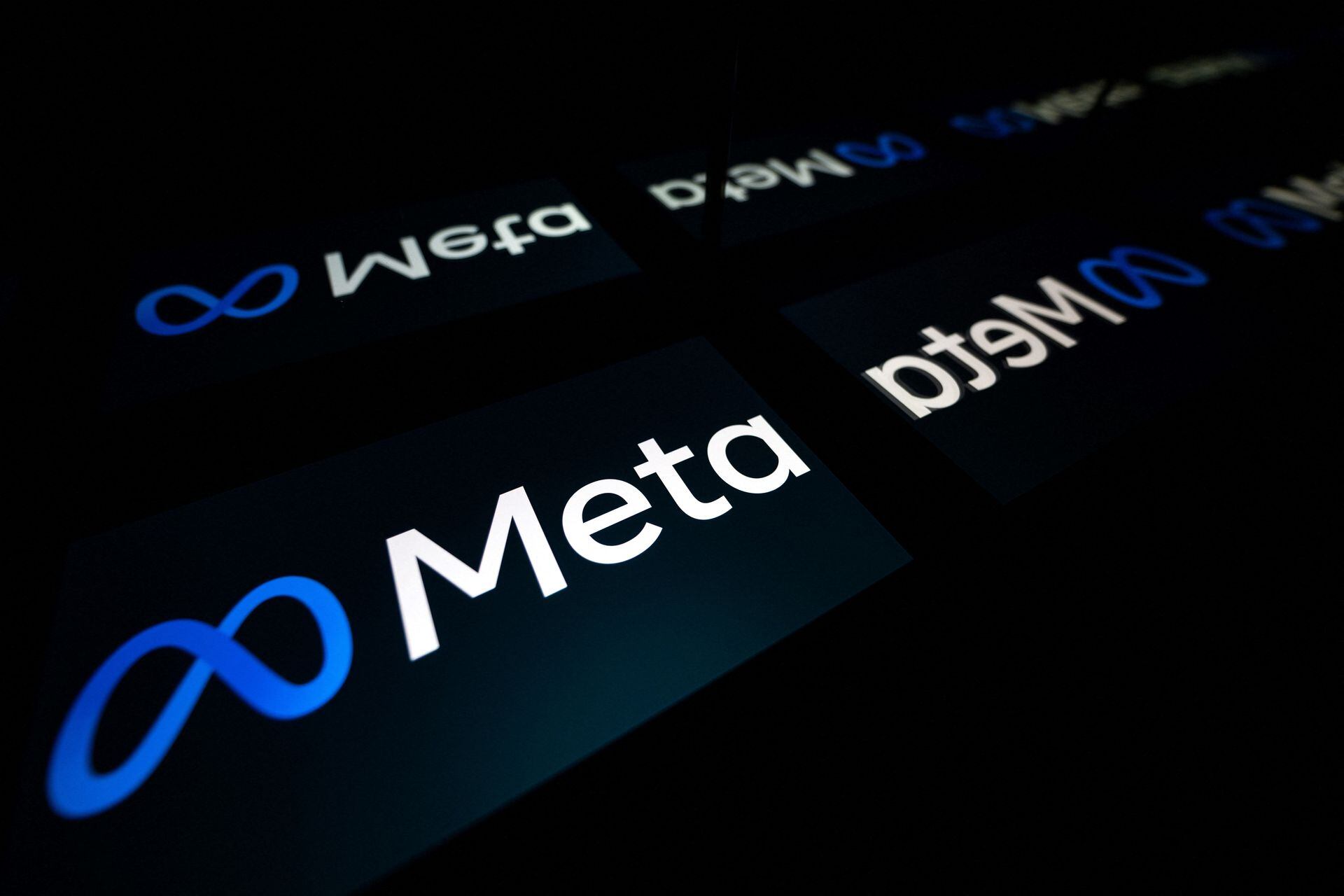 FILES) In this file photo taken on January 12, 2023 this picture taken in Toulouse, southwestern France shows a tablet displaying the logo of the company Meta. - Meta on May 3, 2023 warned that hackers are using the promise of generative artificial intelligence like ChatGPT to trick people into installing malicious code on devices. (Photo by Lionel BONAVENTURE / AFP)