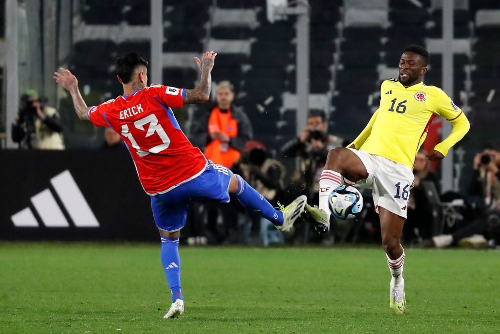 SANTIAGO, CHILE - SEPTEMBER 12: Erick Pulgar of Chile battles for possession with Jefferson Lerma of Colombia during a FIFA World Cup 2026 Qualifier match between Chile and Colombia at Estadio Monumental David Arellano on September 12, 2023 in Santiago, Chile. (Photo by Marcelo Hernandez/Getty Images)
