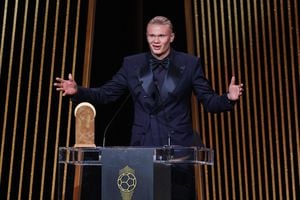 Manchester City's Norwegian forward Erling Haaland gestures on stage as he receives the Gerd Muller Trophy for Best Striker during the 2023 Ballon d'Or France Football award ceremony at the Theatre du Chatelet in Paris on October 30, 2023. (Photo by FRANCK FIFE / AFP)