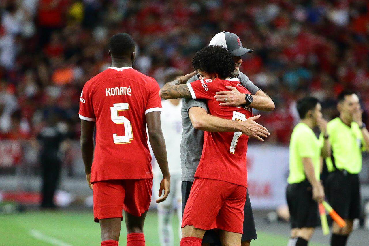 Jurgen Klopp, manager of Liverpool  shares a hug with Luis Diaz during the pre-season friendly match between Bayern Munich and Liverpool at National Stadium on August 2, 2023 in Singapore.
 (Photo by Suhaimi Abdullah/NurPhoto via Getty Images)