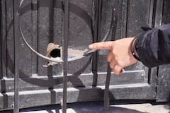 A person points at a bullet hole a day after an armed attack on a playground in San Francisco del Rincon, Guanajuato state, Mexico on February 18, 2026. An armed attack in the state of Guanajuato, in central Mexico, left a 36-year-old man dead and at least eight youths injured on a playground on February 17, 2026, another violent episode in the region that provoked terror among local neighbors. (Photo by Mario ARMAS / AFP)