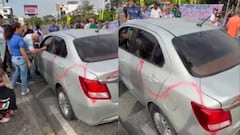 Comerciantes y residentes bloquean el paso vehicular en la Avenida Roosevelt, en el sur de Cali, como medida de protesta contra el proyecto de renovación urbana.