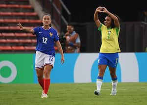 Brazil's forward Vendito (R) celebrates next to France's defender Pauline Sierra after scoring during the 2024 FIFA U-20 Women's World Cup match between France and Brazil at the Atanasio Girardot stadium in Medellin, Colombia, on September 3, 2024. (Photo by JAIME SALDARRIAGA / AFP)