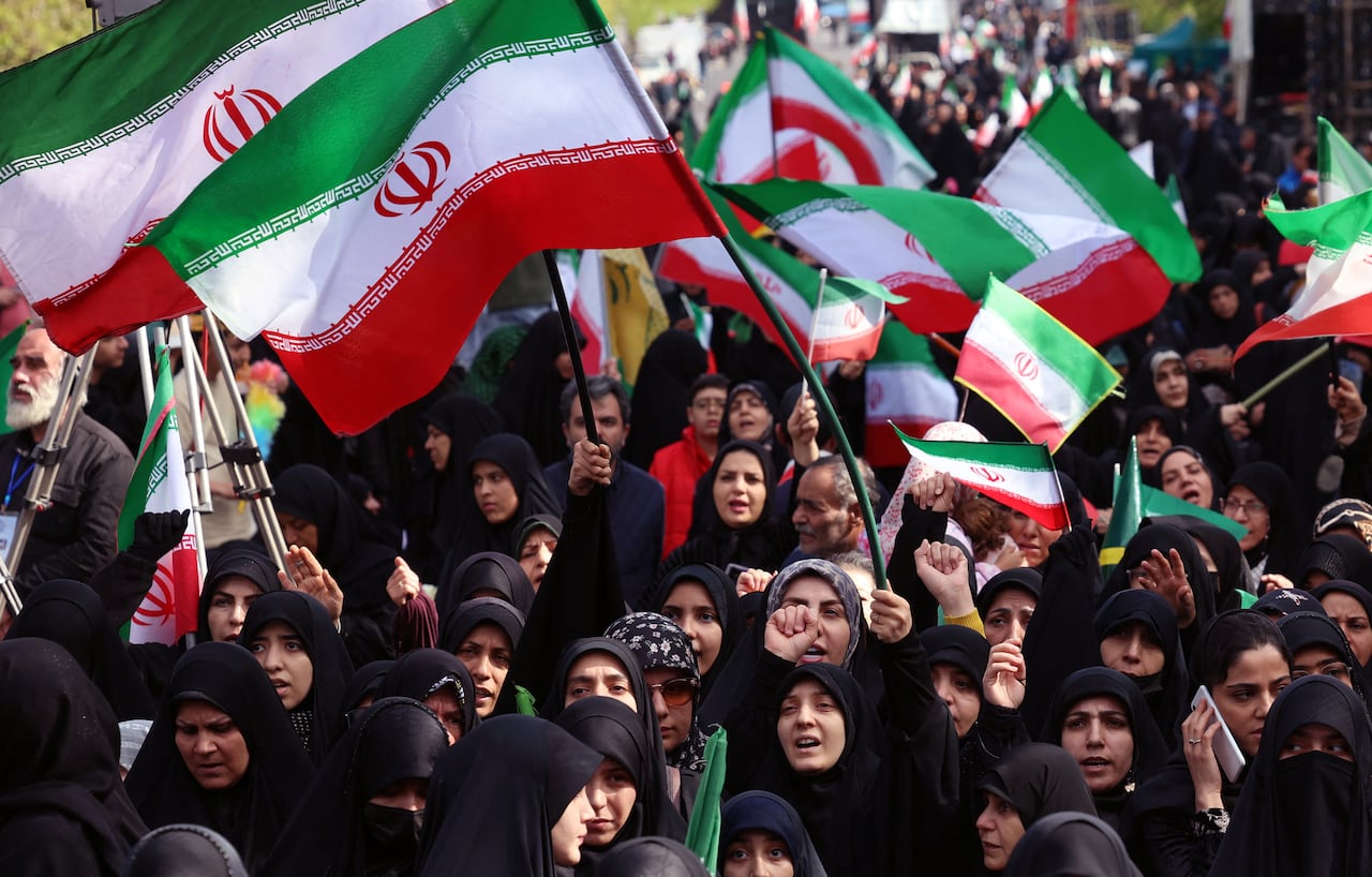 Iranians rally during a memorial, 40 days after a deadly strike on a children�s school in the southern city of Minab on the first day of the war that killed at least 165 people, most of them children, in Tehran on April 7, 2026. On February 28, Israel and the United States launched strikes on Iran, killing its supreme leader and triggering a war that spread across the Middle East. (Photo by AFP) /