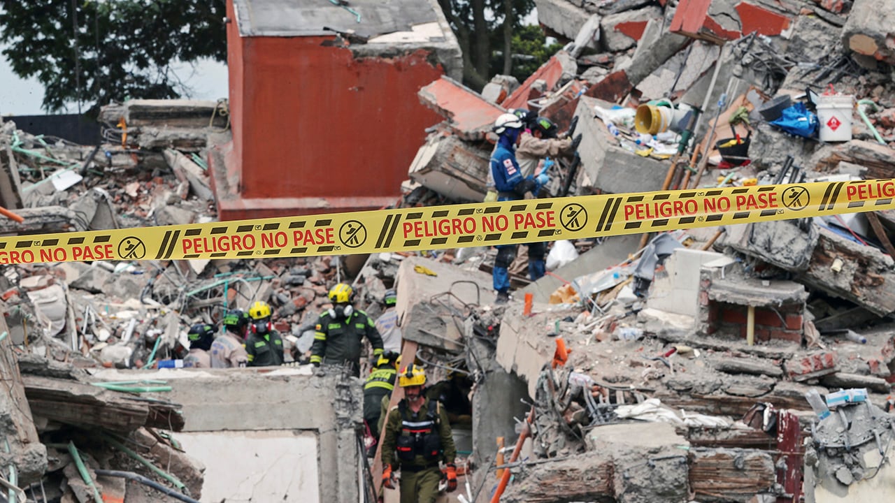 Caution tape cordons off a building collapsed by the earthquake in Cali, Colombia, Sunday, Aug. 16, 2026. (AP Photo/Santiago Saldarriaga)