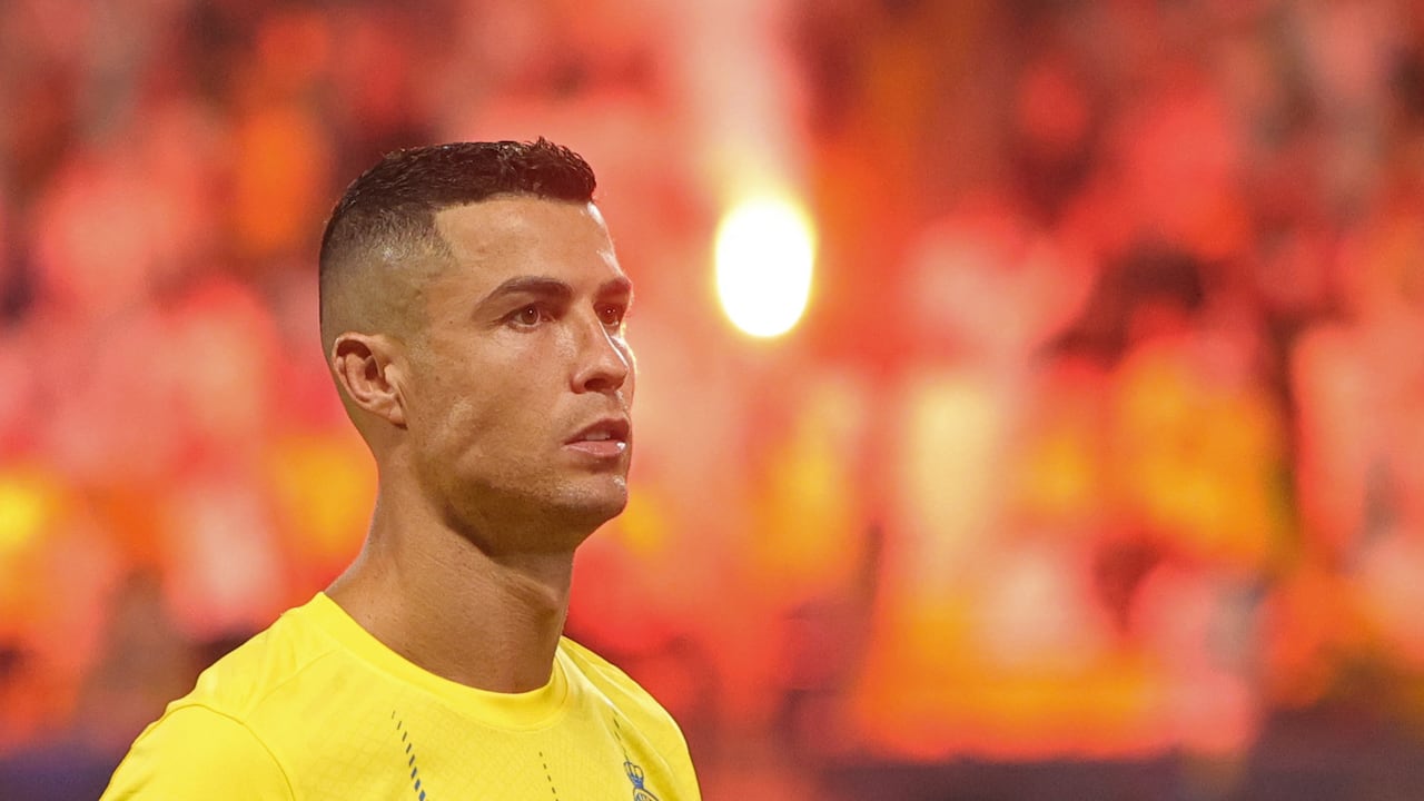 Nassr's Portuguese forward #07 Cristiano Ronaldo stands for the national anthem before the start of the Saudi Pro League football match between Al-Nassr and Al-Taawoun at King Saud University Stadium in Riyadh on August 18, 2023. (Photo by Fayez Nureldine / AFP)