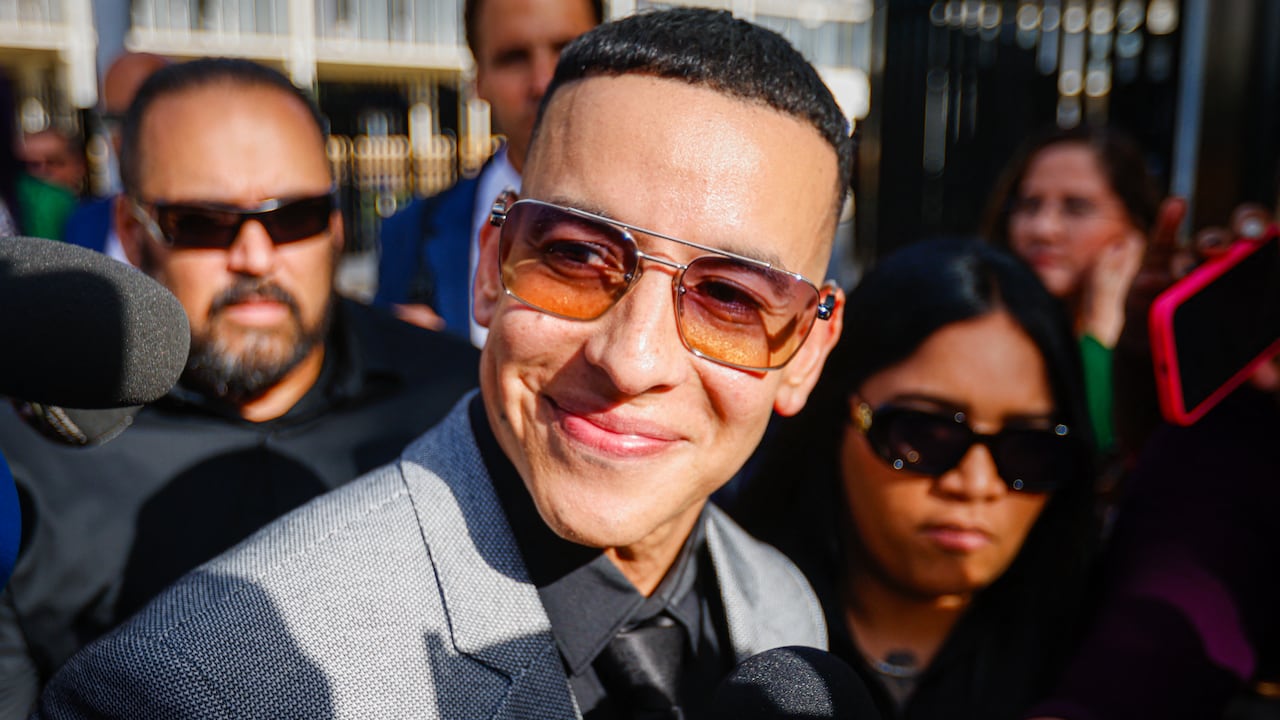 Daddy Yankee speaks to the media as he leaves the United States Federal Court for the District of Puerto Rico following a hearing in San Juan, Puerto Rico, on August 14, 2025. The rapper appears in court after filing a lawsuit against his ex-wife, Mireddys Gonzalez, and his former sister-in-law, Ayeicha Gonzalez, alleging they delete important information from the companies El Cartel Productions and Los Cangris Inc., seeking $12 million in damages. (Photo by Edgardo Medina/NurPhoto) (Photo by Edgardo Medina / NurPhoto via AFP)