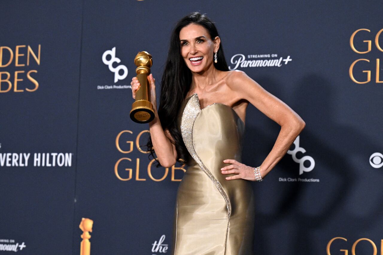 US actress Demi Moore poses with the Best Performance by a Female Actor in a Motion Picture � Musical or Comedy award for "The Substance" in the press room during the 82nd annual Golden Globe Awards at the Beverly Hilton hotel in Beverly Hills, California, on January 5, 2025. (Photo by Robyn Beck / AFP)