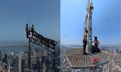 La pareja subió al mástil del Empire State Building y desplegó una enorme pancarta.