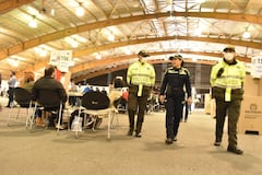 Votación, voto, elecciones, gente votando, urnas, puesto de votación, mesa en Bogotá, Corferias Policia