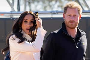 FILE - Prince Harry and Meghan Markle, Duke and Duchess of Sussex visit the track and field event at the Invictus Games in The Hague, Netherlands, Sunday, April 17, 2022.   The production company founded by Prince Harry and his wife, Meghan, are splitting ways with Spotify, Friday, June 16, 2023, less than a year after the debut of their podcast “Archetypes."(AP Photo/Peter Dejong, File)