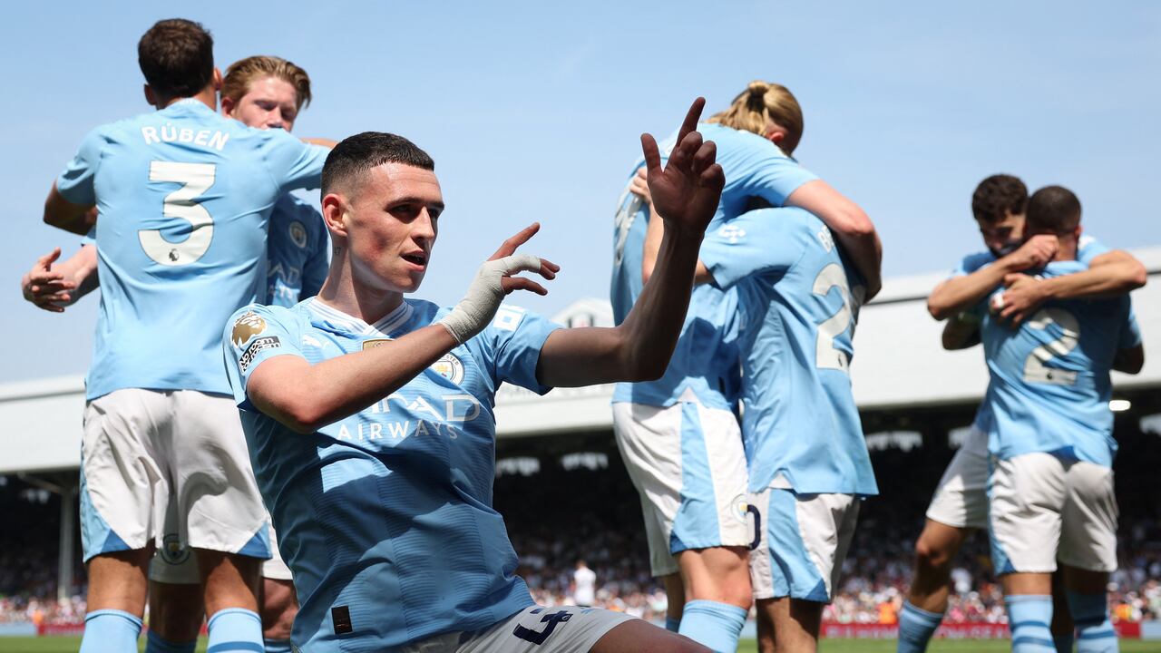 Manchester City's English midfielder #47 Phil Foden celebrates scoring the team's second goal during the English Premier League football match between Fulham and Manchester City at Craven Cottage in London on May 11, 2024. (Photo by Adrian DENNIS / AFP) / RESTRICTED TO EDITORIAL USE. No use with unauthorized audio, video, data, fixture lists, club/league logos or 'live' services. Online in-match use limited to 120 images. An additional 40 images may be used in extra time. No video emulation. Social media in-match use limited to 120 images. An additional 40 images may be used in extra time. No use in betting publications, games or single club/league/player publications. /