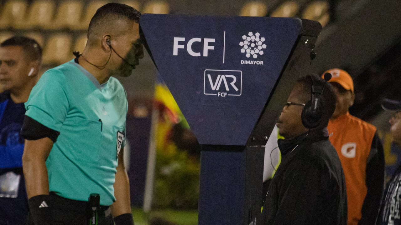 A referee checks the VAR unit during the Deportivo Pasto (1) V Fortaleza (0) match during the BetPlay league in Pasto, Colombia, March 4, 2024. Photo by: Sebastian Maya/Long Visual Press (Photo by: Sebastian Maya/Long Visual Press/Universal Images Group via Getty Images)
