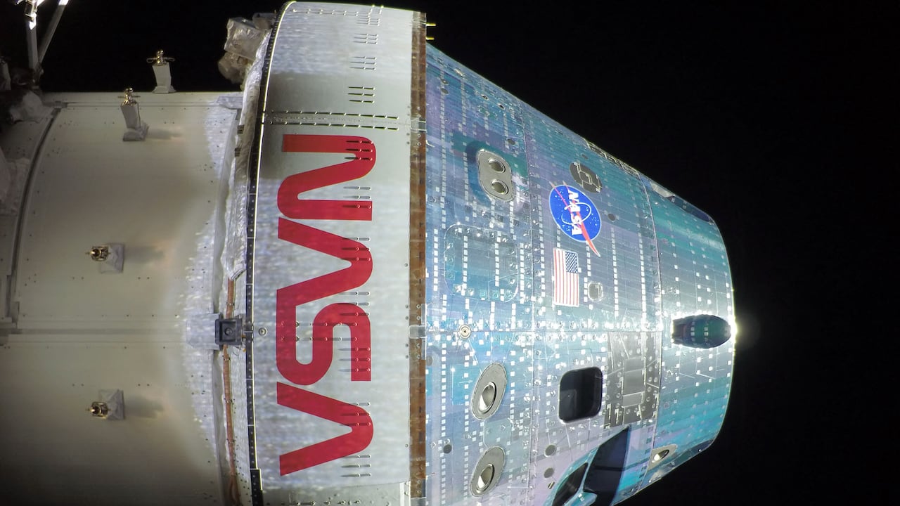 This handout picture provided by NASA shows the Orion spacecraft captured by a camera mounted on one of its solar array wings during a routine external inspection of the spacecraft on the second day into the Artemis II mission, on April 3, 2026. As Artemis II astronauts forged ahead on their lunar mission, NASA released initial images taken from the Orion spacecraft, including a full portrait of Earth featuring its deep blue oceans and billowing clouds. After a flurry of high-stakes activity including a dramatic blast-off and an engine firing that catapulted them on their historic trajectory to circle the Moon, the four astronauts aboard were able to catch their breath, even as they continued to perform a variety of equipment checks and tests. (Photo by NASA / AFP) / RESTRICTED TO EDITORIAL USE - MANDATORY CREDIT "AFP PHOTO / NASA" - NO MARKETING NO ADVERTISING CAMPAIGNS - DISTRIBUTED AS A SERVICE TO CLIENTS