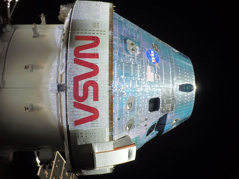 This handout picture provided by NASA shows the Orion spacecraft captured by a camera mounted on one of its solar array wings during a routine external inspection of the spacecraft on the second day into the Artemis II mission, on April 3, 2026. As Artemis II astronauts forged ahead on their lunar mission, NASA released initial images taken from the Orion spacecraft, including a full portrait of Earth featuring its deep blue oceans and billowing clouds. After a flurry of high-stakes activity including a dramatic blast-off and an engine firing that catapulted them on their historic trajectory to circle the Moon, the four astronauts aboard were able to catch their breath, even as they continued to perform a variety of equipment checks and tests. (Photo by NASA / AFP) / RESTRICTED TO EDITORIAL USE - MANDATORY CREDIT "AFP PHOTO / NASA" - NO MARKETING NO ADVERTISING CAMPAIGNS - DISTRIBUTED AS A SERVICE TO CLIENTS