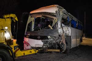 This photograph shows the Spanish damaged bus towed by a truck in Porte-Puymorens, southern France, on December 1, 2024, following its accident en route from Barcelona to Andorra. A Spanish coach travelling between Barcelona and Andorra overturned on a mountain road in the ski resort of Porte-Puymorens (Pyrenees-Orientales) on December 1, 2024, killing at least two people and seriously injuring seven others, the prefecture and police said. The �provisional toll� issued by the Pyrenees-Orientales prefecture also stated that seven people were �injured in relative emergency�. (Photo by Jean-Christophe MILHET / AFP)