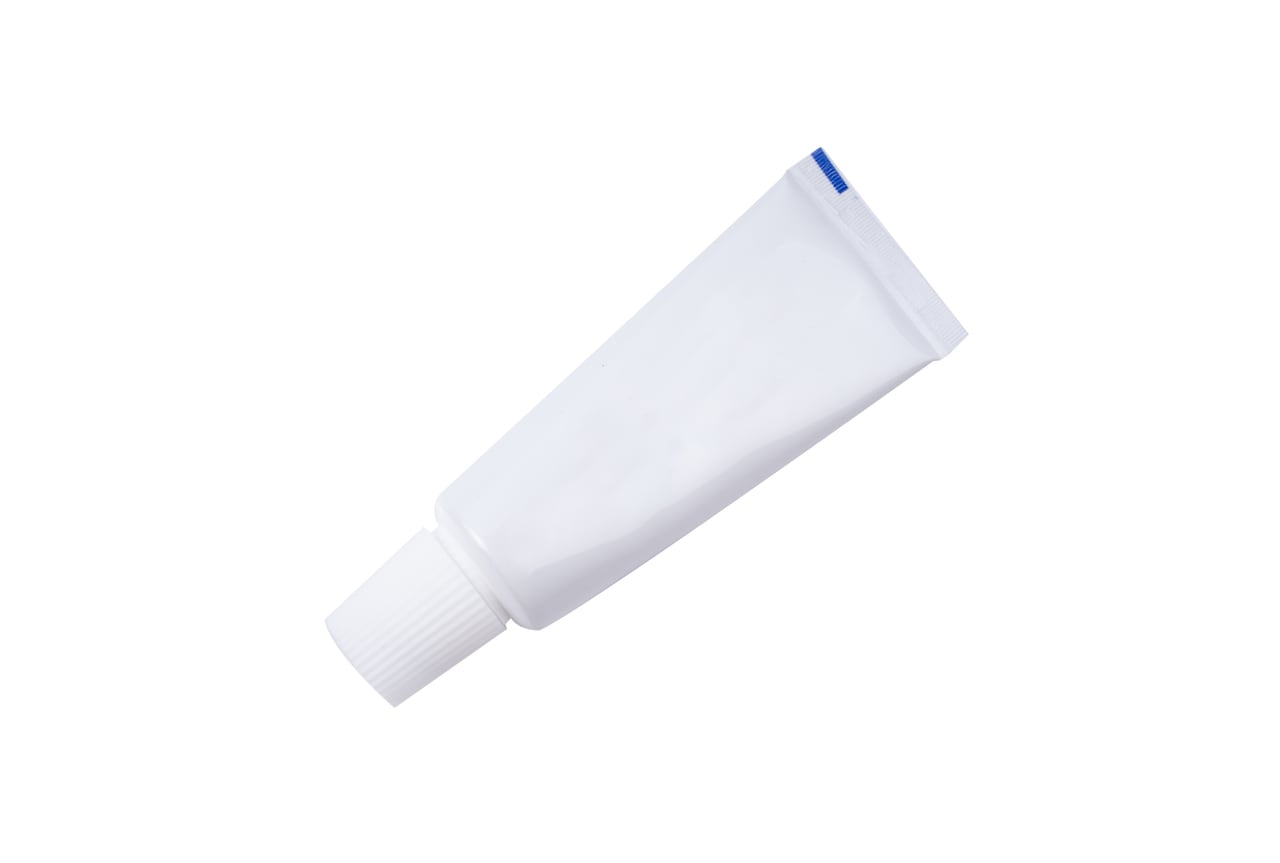 Tube of toothpaste or cream isolated on white background.