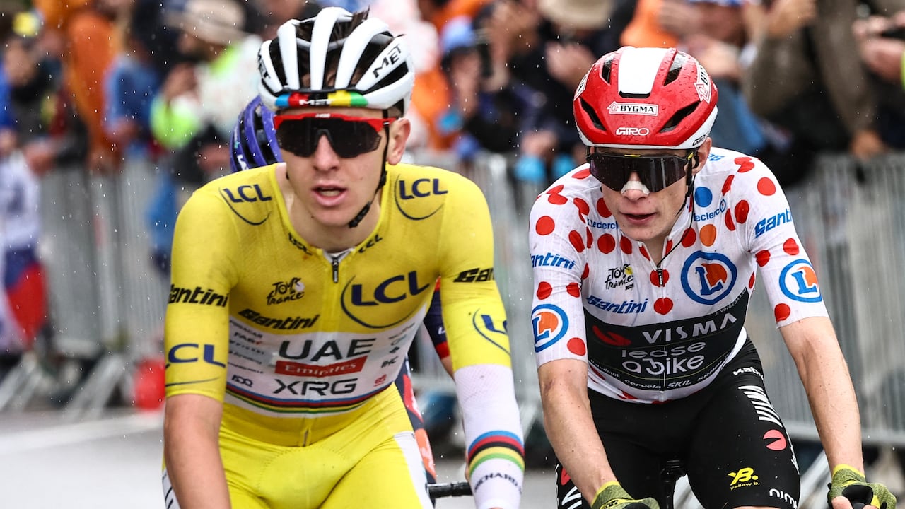 UAE Team Emirates - XRG team's Slovenian rider Tadej Pogacar wearing the overall leader's yellow jersey and Team Visma - Lease a bike team's Danish rider Jonas Vingegaard wearing the best climber's polka dot (dotted) jersey cycle in the final ascent of La Plagne during the 19th stage of the 112th edition of the Tour de France cycling race, 93.1 km between Albertville and La Plagne, in the French Alps, on July 25, 2025. The 19th stage of the Tour de France was shorted from its initial 129.9 km route, bypassing the Col des Saisies where an outbreak of nodular dermatitis in a herd of cattle was discovered, prompting organizers to modify the race route. (Photo by Anne-Christine POUJOULAT / AFP)