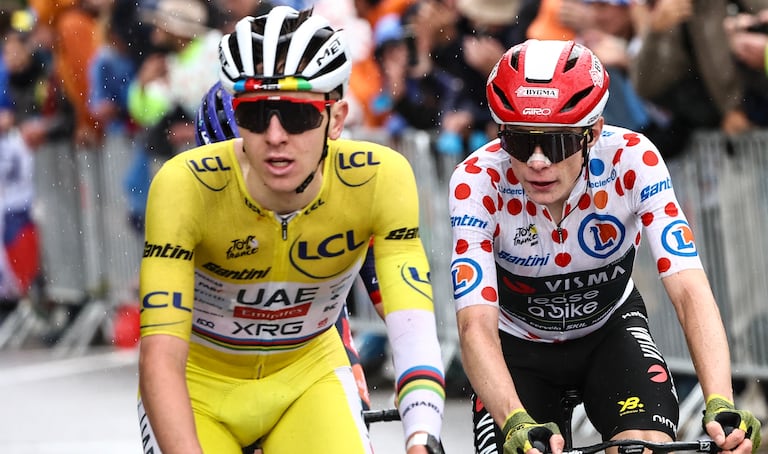 UAE Team Emirates - XRG team's Slovenian rider Tadej Pogacar wearing the overall leader's yellow jersey and Team Visma - Lease a bike team's Danish rider Jonas Vingegaard wearing the best climber's polka dot (dotted) jersey cycle in the final ascent of La Plagne during the 19th stage of the 112th edition of the Tour de France cycling race, 93.1 km between Albertville and La Plagne, in the French Alps, on July 25, 2025. The 19th stage of the Tour de France was shorted from its initial 129.9 km route, bypassing the Col des Saisies where an outbreak of nodular dermatitis in a herd of cattle was discovered, prompting organizers to modify the race route. (Photo by Anne-Christine POUJOULAT / AFP)