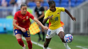 Colombia's Linda Caicedo, right, and Spain's Ona Batlle battle for the ball during the women's quarter-final soccer match between Spain and Colombia, at Lyon Stadium, during the 2024 Summer Olympics, Saturday, Aug. 3, 2024, in Decines, France. (AP Photo/Silvia Izquierdo)