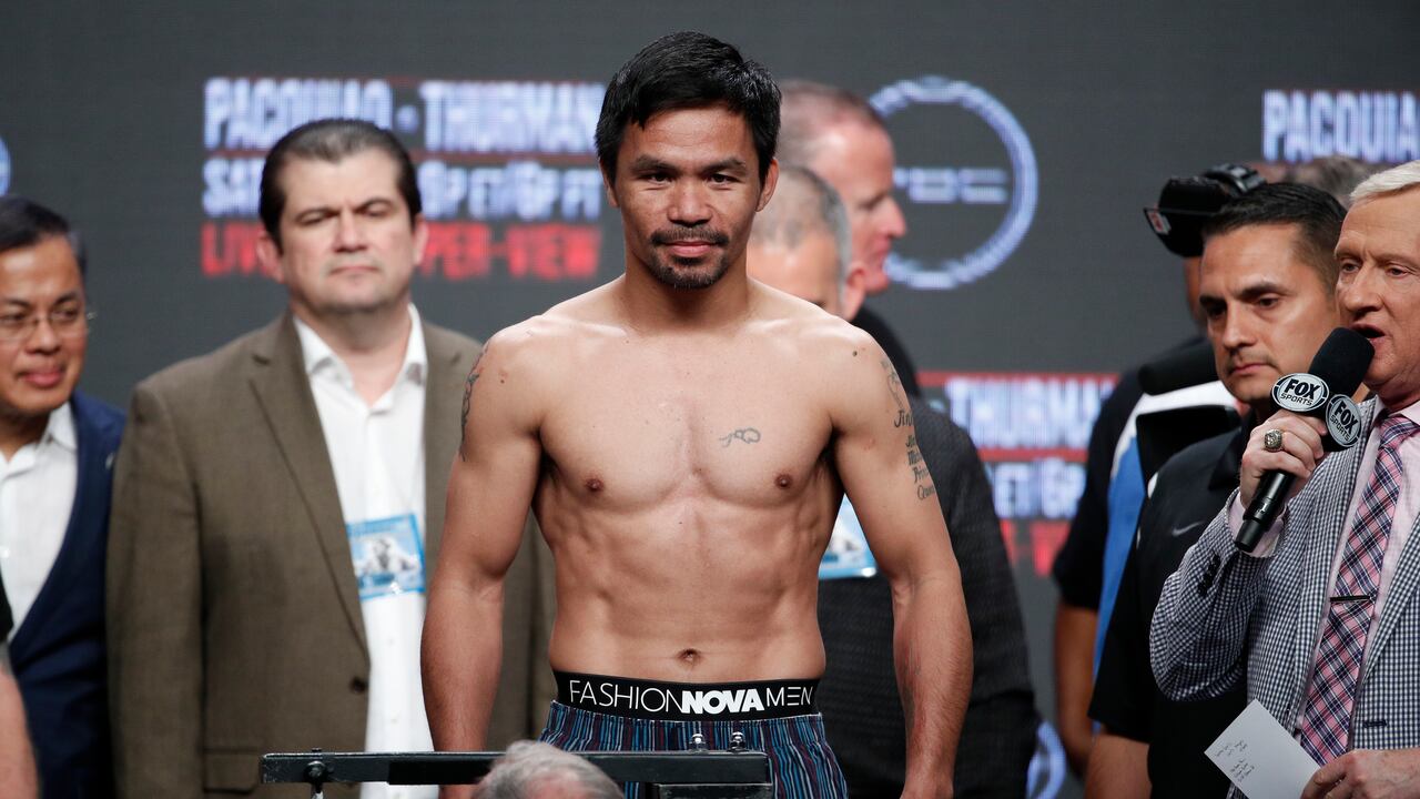 Manny Pacquiao stands on the scale during a weigh-in Las Vegas.