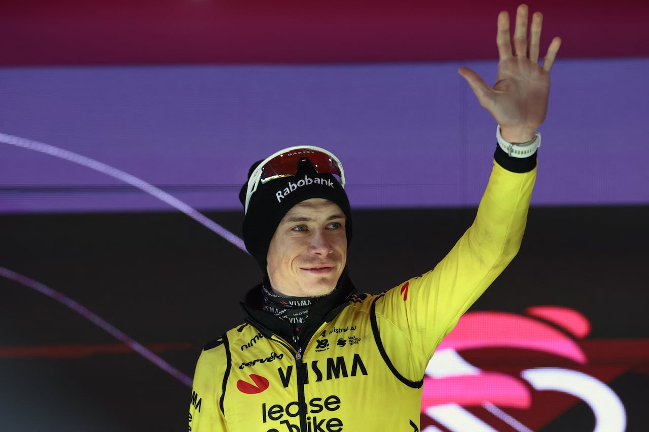 Team Visma Lease a Bike Danish rider Jonas Vingegaard, celebrates on the podium after winning the 9th stage of the Giro d'Italia 2026 - Tour of Italy cycling race between Cervia and Corno alle Scale, near Doganaccia, central Italy on May 17, 2026. (Photo by Luca Bettini / AFP)