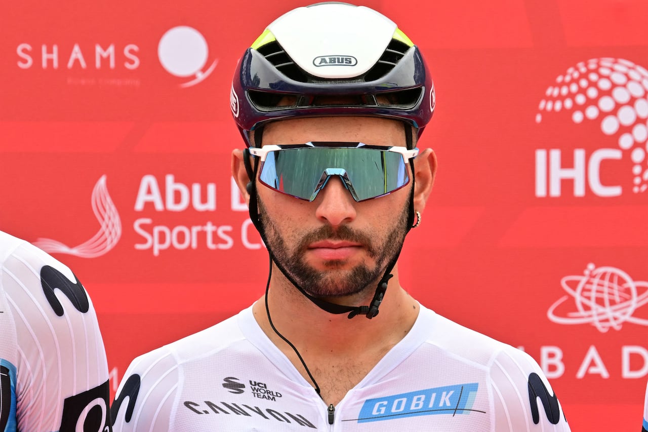 Movistar team's Colombian rider Fernando Gaviria looks on during the first stage of the UAE Tour cycling race from Shams Solar Power Station Madinat Zayed to Liwa Palace in Abu Dhabi on February 17, 2025. (Photo by Giuseppe CACACE / AFP)