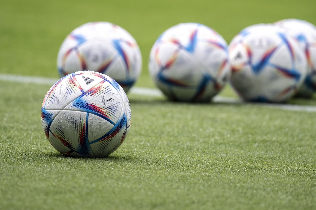 This picture shows the official FIFA World Cup Qatar 2022 footballs called "Al Rihla" during Japan's training session at the Panasonic stadium in Suita, Osaka prefecture on June 13, 2022, ahead of their Kirin Cup final match against Tunisia on June 14. (Photo by Charly TRIBALLEAU / AFP)