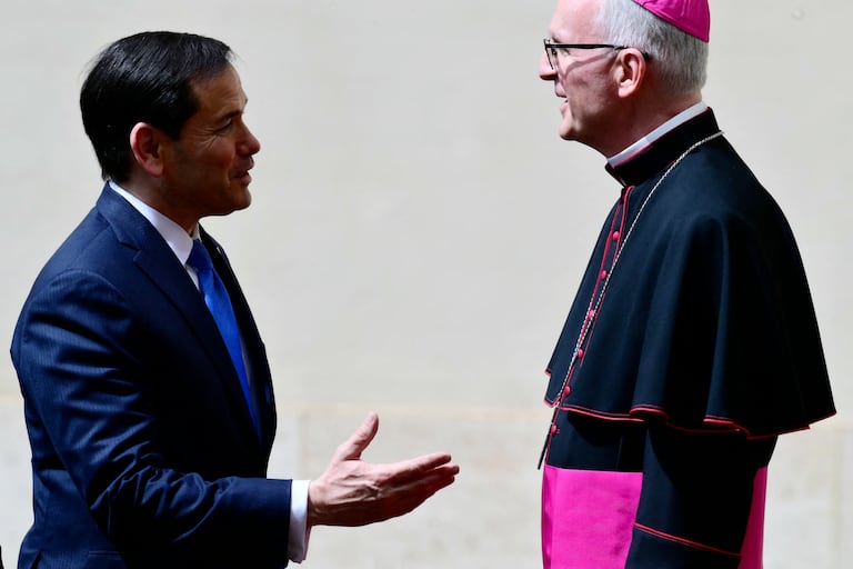 U.S. Secretary of State Marco Rubio is welcomed by the Prefect of the Papal Household Archbishop Petar Rajic as he arrives at San Damaso courtyard in The Vatican prior a private audience with Pope Leo XIV on May 7, 2026. (Photo by Stefano RELLANDINI / AFP)
