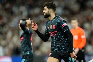 Manchester City's Josko Gvardiol celebrates after scoring his side's third goal during the Champions League quarterfinal first leg soccer match between Real Madrid and Manchester City at the Santiago Bernabeu stadium in Madrid, Spain, Tuesday, April 9, 2024. (AP Photo/Jose Breton)