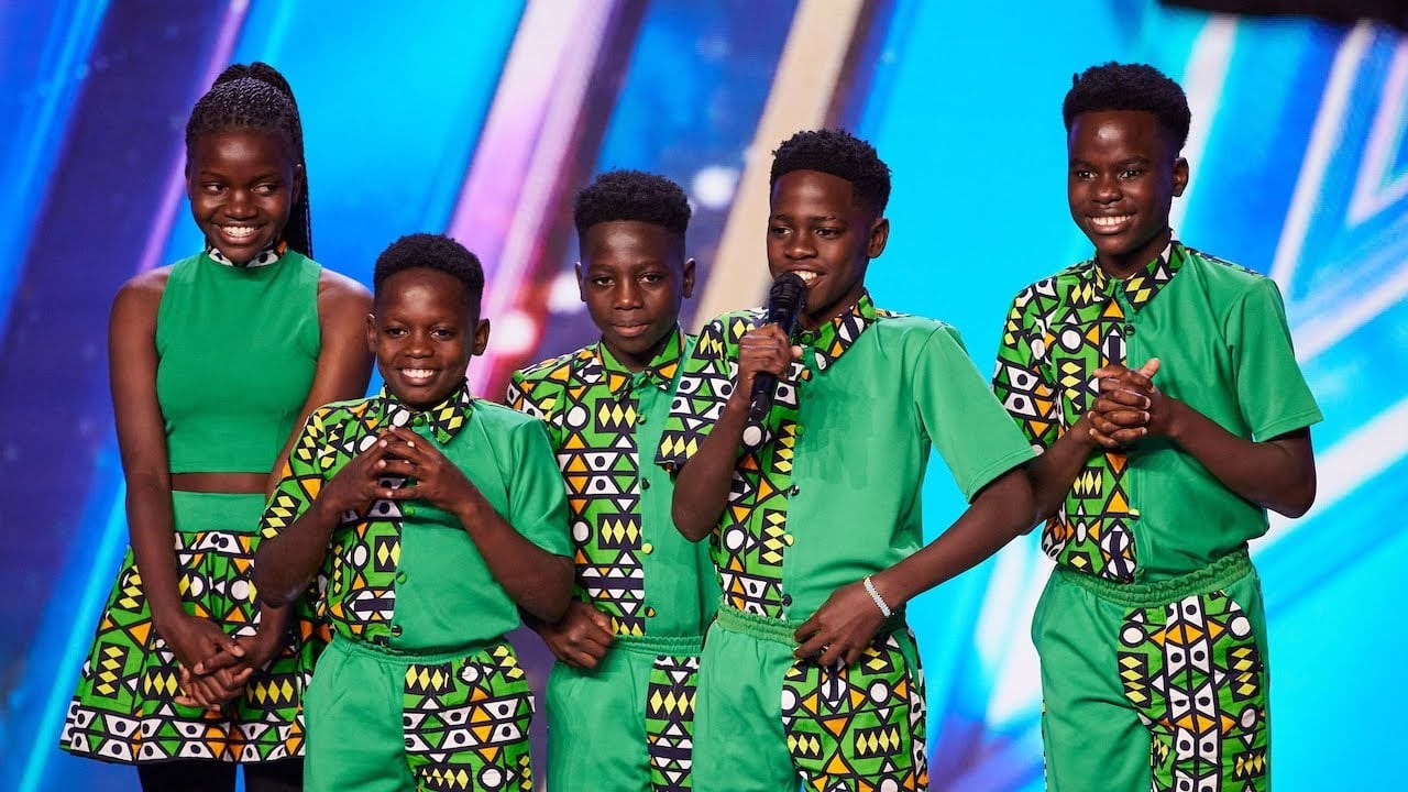 En la temporada 16 de Britain’s Got Talent (2023), su presentación de breakdance y ritmos africanos fue tan electrizante que el juez Bruno Tonioli presionó el Golden Buzzer —algo histórico-, ya que lo hizo antes de que terminara su rutina. Ganaron el sexto lugar y el corazón del público.