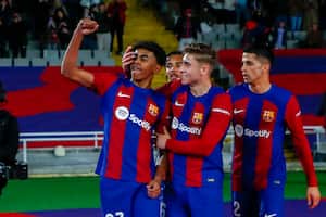 Barcelona's Lamine Yamal, left, celebrates with teammates after scoring his side's opening goal during a Spanish La Liga soccer match between Barcelona and Mallorca at the Olimpic Lluis Companys stadium in Barcelona, Spain, Friday, March 8, 2024. (AP Photo/Joan Monfort)